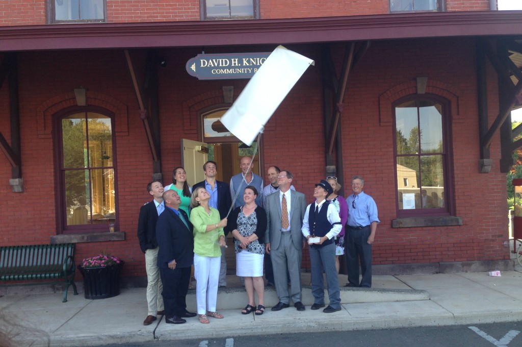 Mayor, Boro Administrator, Council members and members of the Knights family unveil new sign at the Hopewell Boro train station