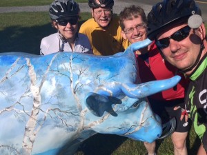 "Rooted," an ox by artist Linda Bradshaw, is shown here with bikers from the LHT trail on Pennington-Rocky Hill Road, where Rooted is installed. Photo courtesy of Hopewell Valley Arts Council. 