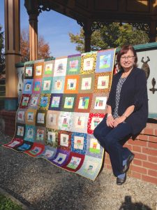 Cindy Friedman with Hopewell’s 125th anniversary children’s quilt