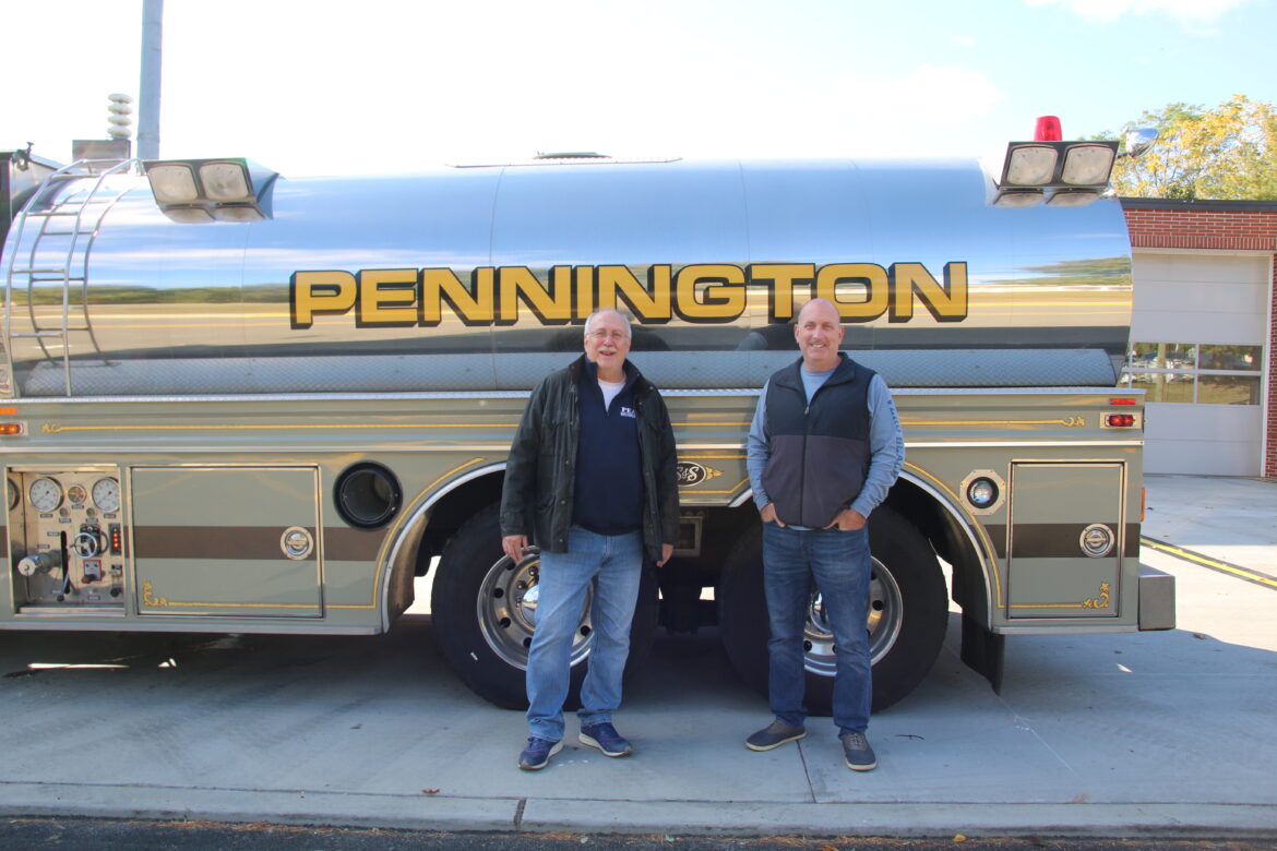 Bob DiFalco and Brian Hofacker stand in front of the aging Pennington Fire Company tanker, which the fire district is seeking to replace.